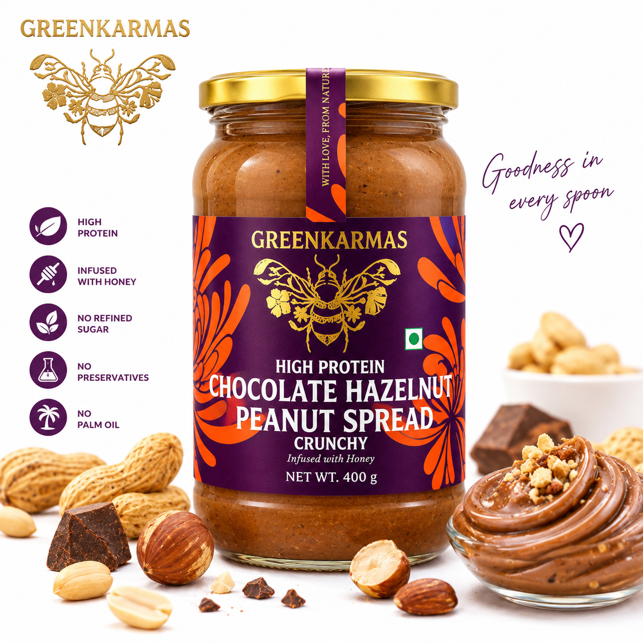 A jar of Greenkarmas High Protein Chocolate Hazelnut Peanut Spread is shown on a white background with decorative peanuts, hazelnuts, chocolate pieces, and a swirl of spread on a spoon. Text on the left lists product benefits, and text on the right reads 'Goodness in every spoon'.